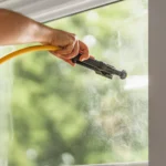 Hand cleaning window glass